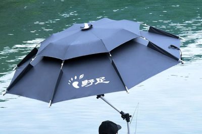 钓鱼伞是什么，是帮助钓鱼人遮风避雨和挡紫外线的工具